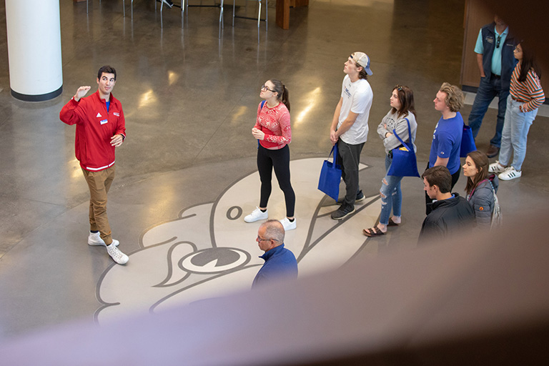 Image of students and parents touring campus.